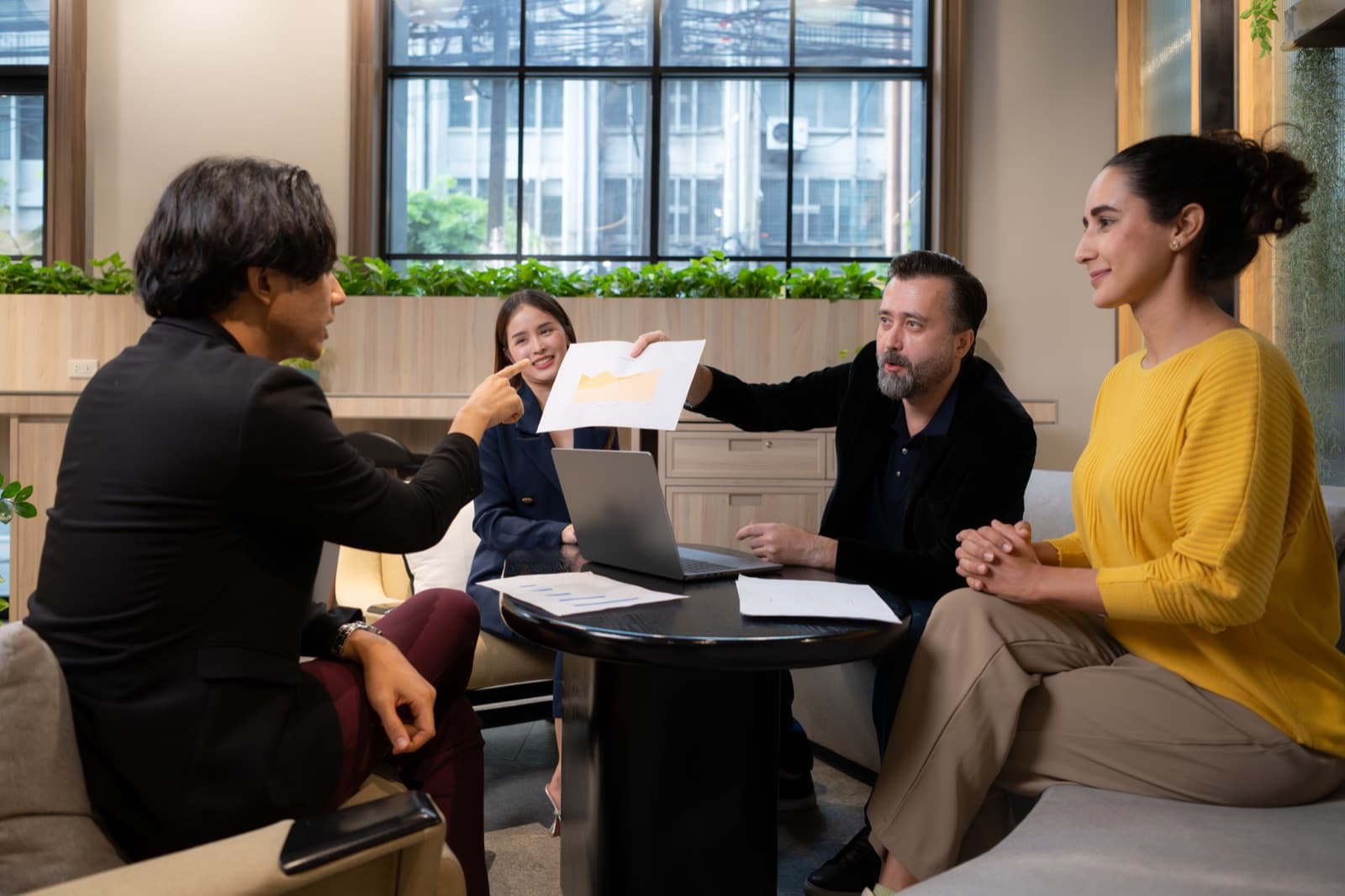Project team reviewing recovery work in a client meeting
