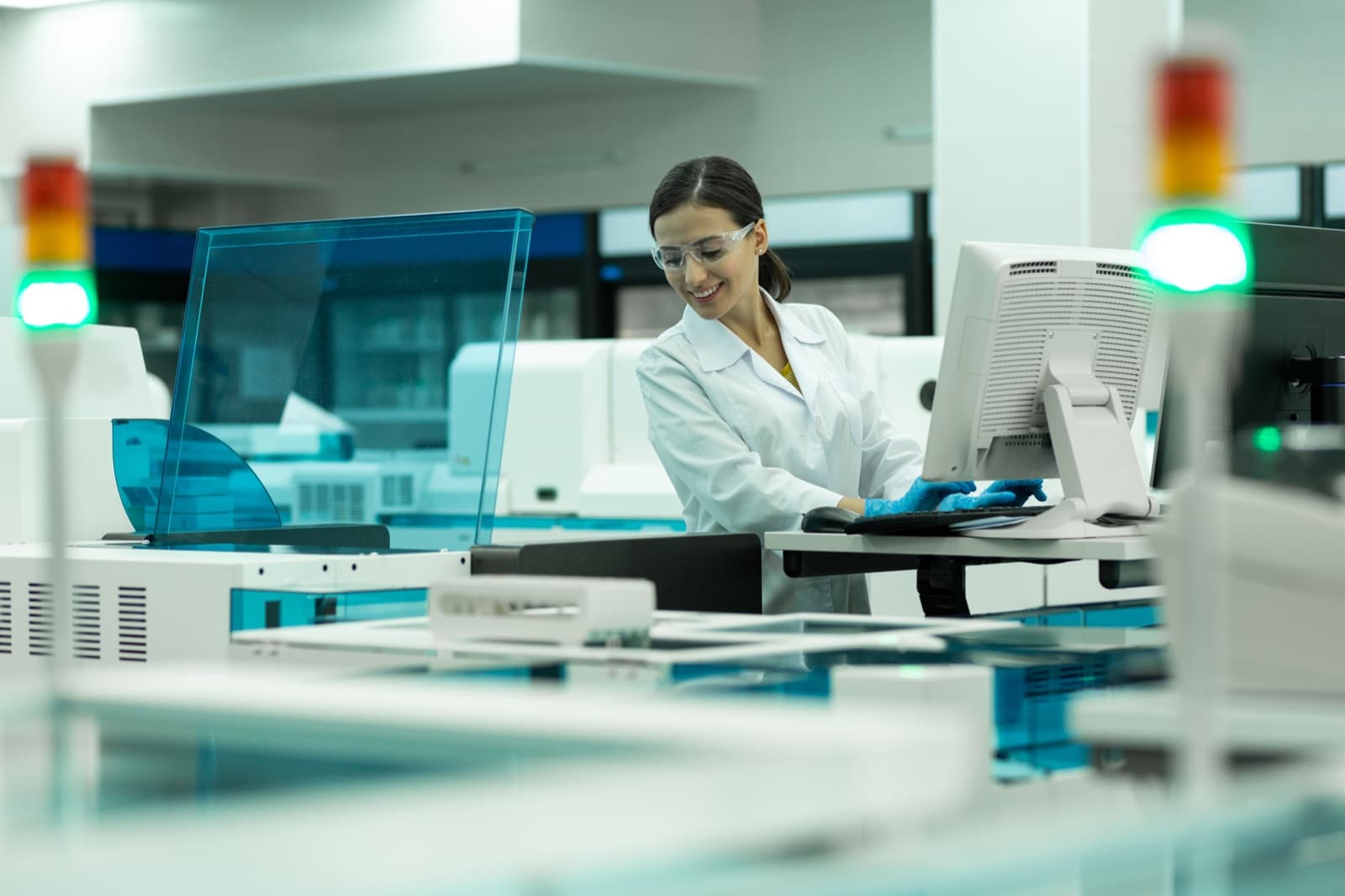 Dental lab technician working at a clinical workstation